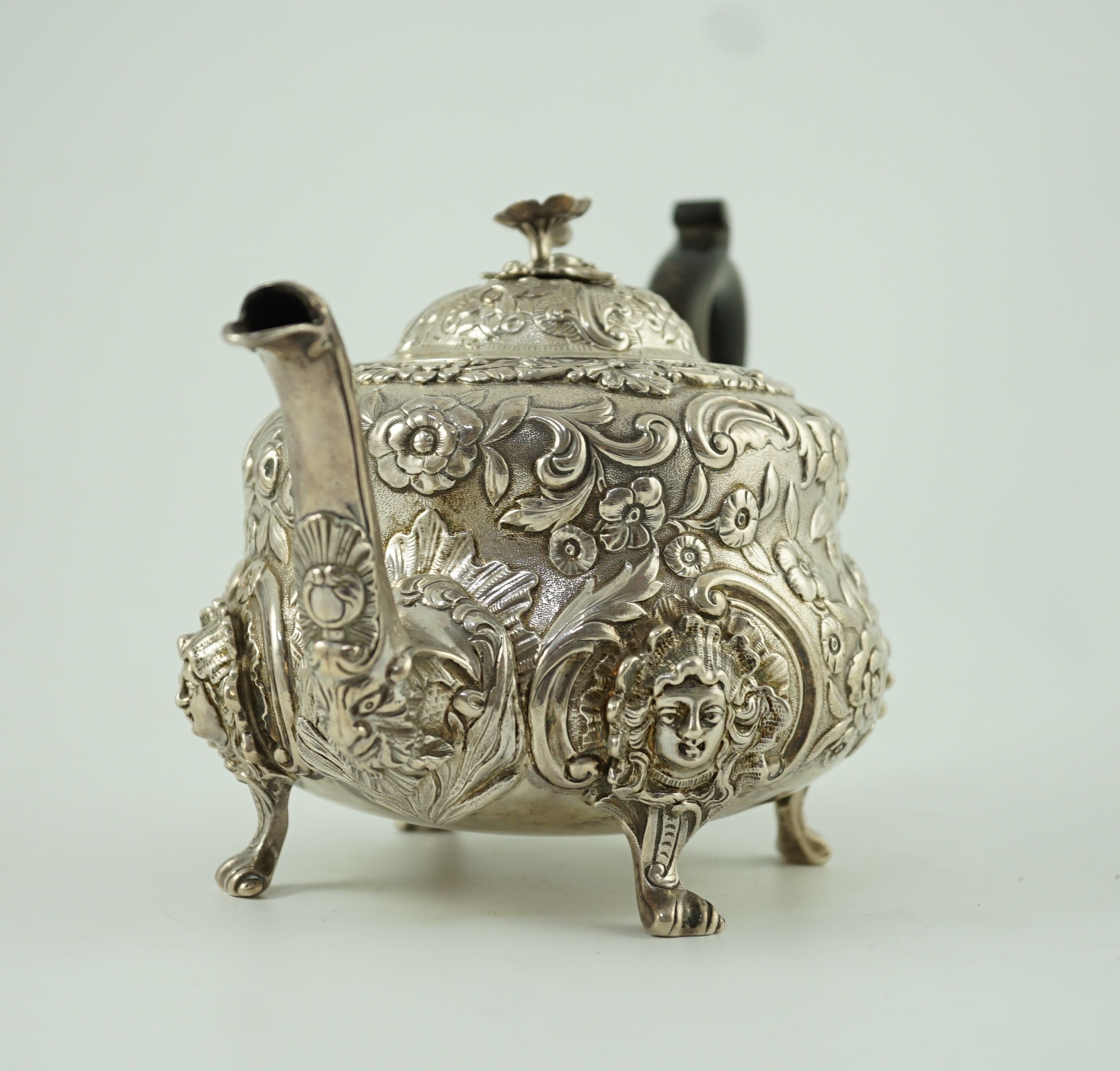 An early Victorian embossed silver teapot, by William Moulson